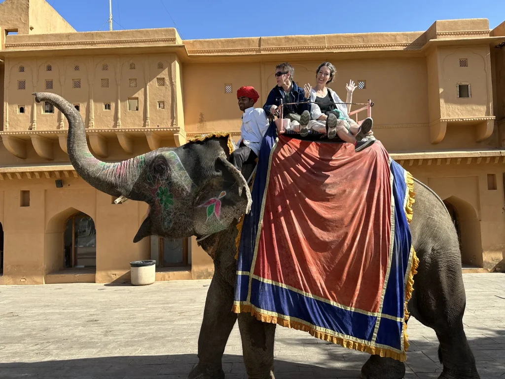 Travellers riding an elephant up to Amber Fort, Jaipur