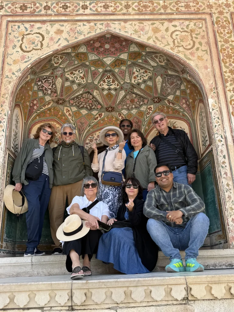 Travellers sightseeing at a Rajasthan palace with a private guide on a Golden Triangle tour