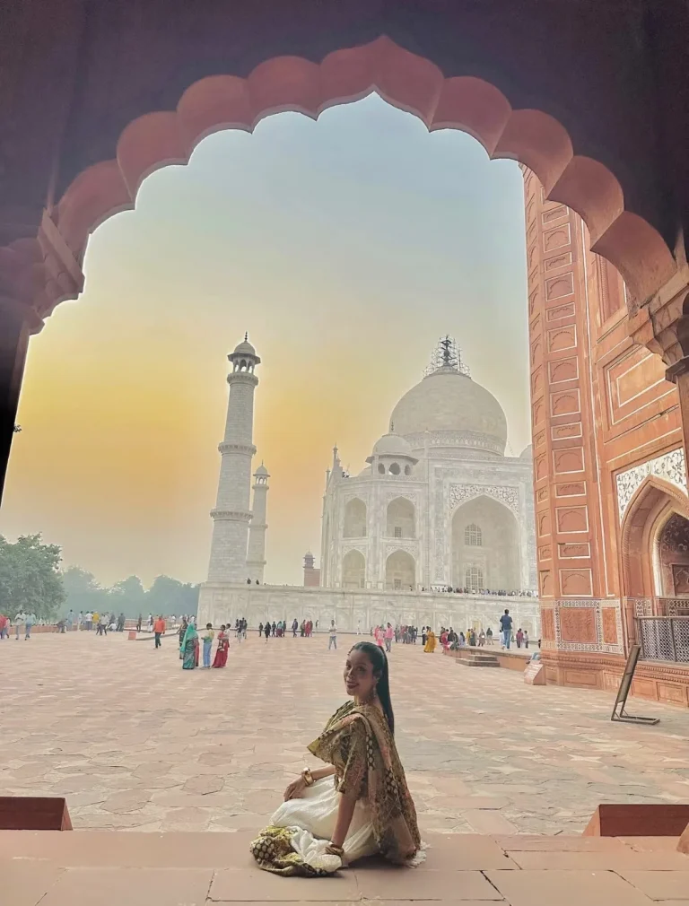 Travellers framed in a Taj Mahal archway in Agra on a Golden Triangle tour from the USA